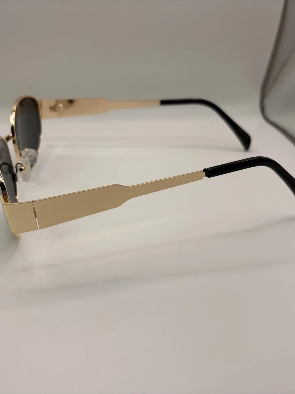 Gold Frame Oval Sunglasses with Dark Lenses
